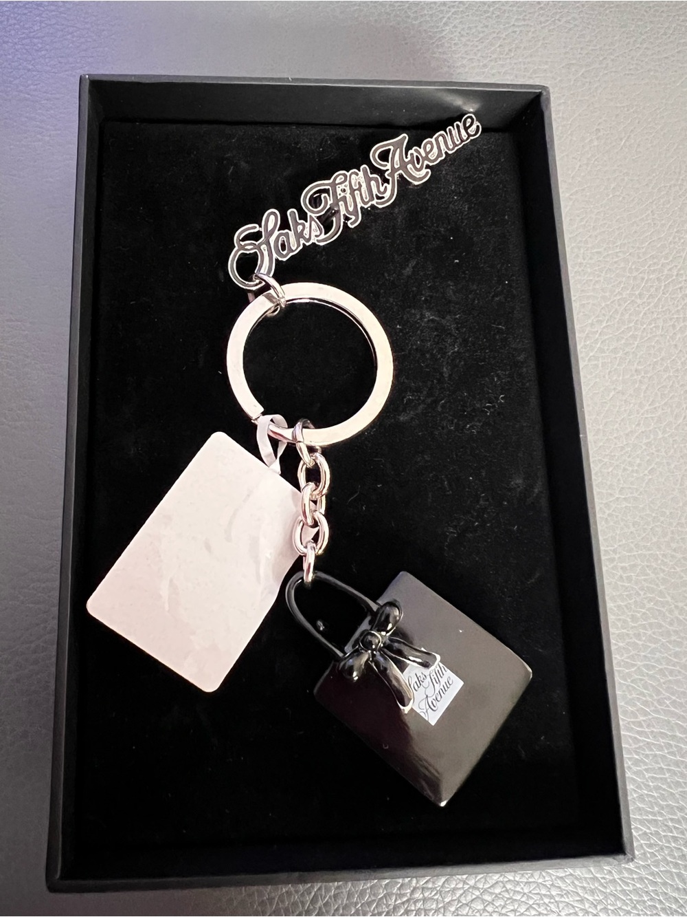 Saks Fifth Avenue Silver Keyring with Black Purse and Pale Pink Tag